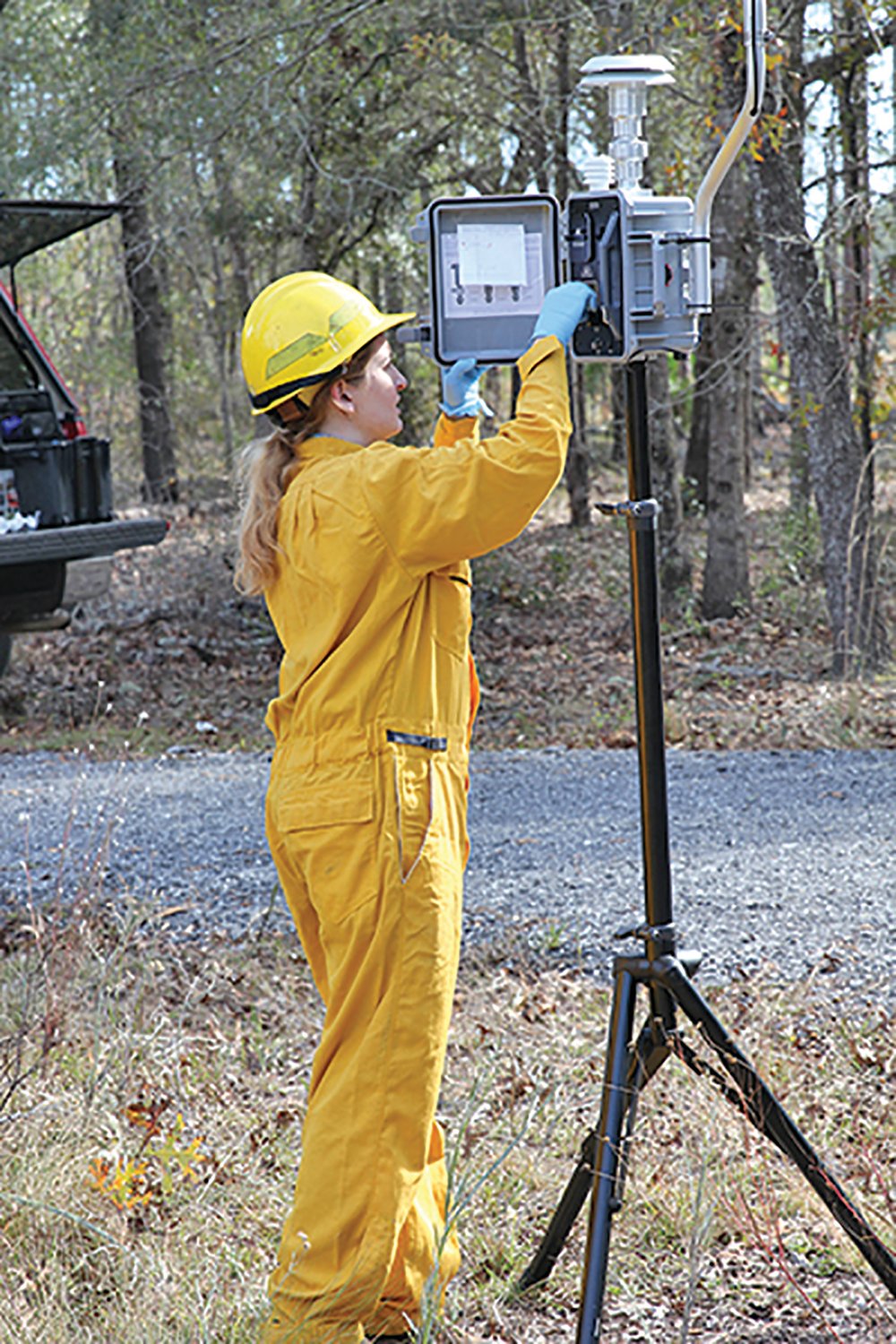 Rachel Moore collects smoke samples at the UF/IFAS Ordway-Swisher Biological Station.